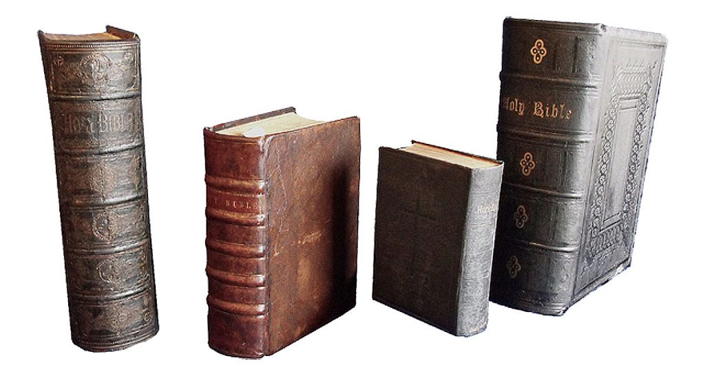 The same four Bibles after they had been restored. Bible repair