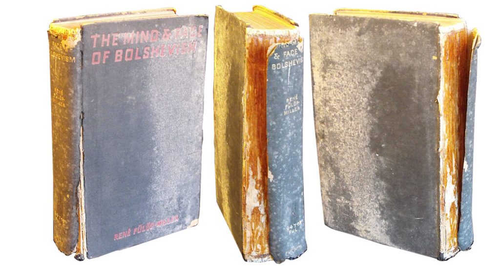 This volume had a damaged spine that was part-detached. Its binding had also been discoloured by mould.