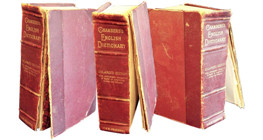 An Edwardian edition of Chambers dictionary in need of spine repair