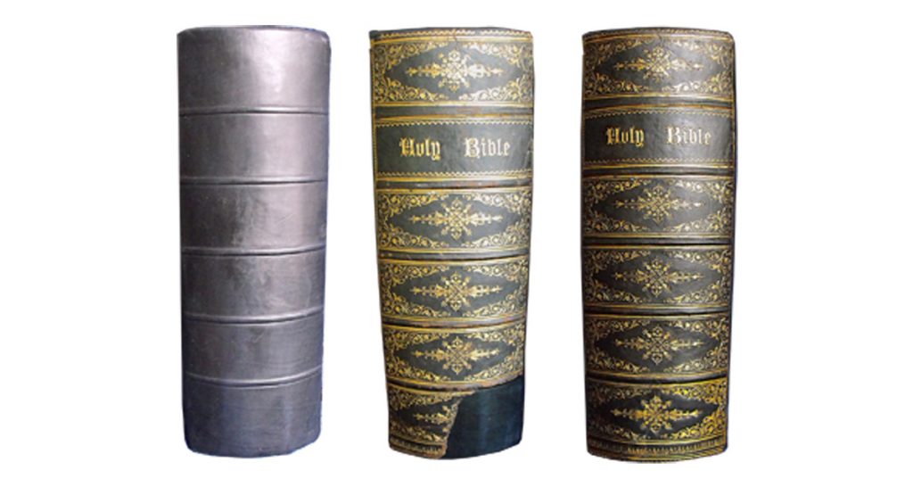 Another view of the same Bible's spine. The original spine was mounted onto the new spine and the missing gold decoration was re-tooled. Bible repair