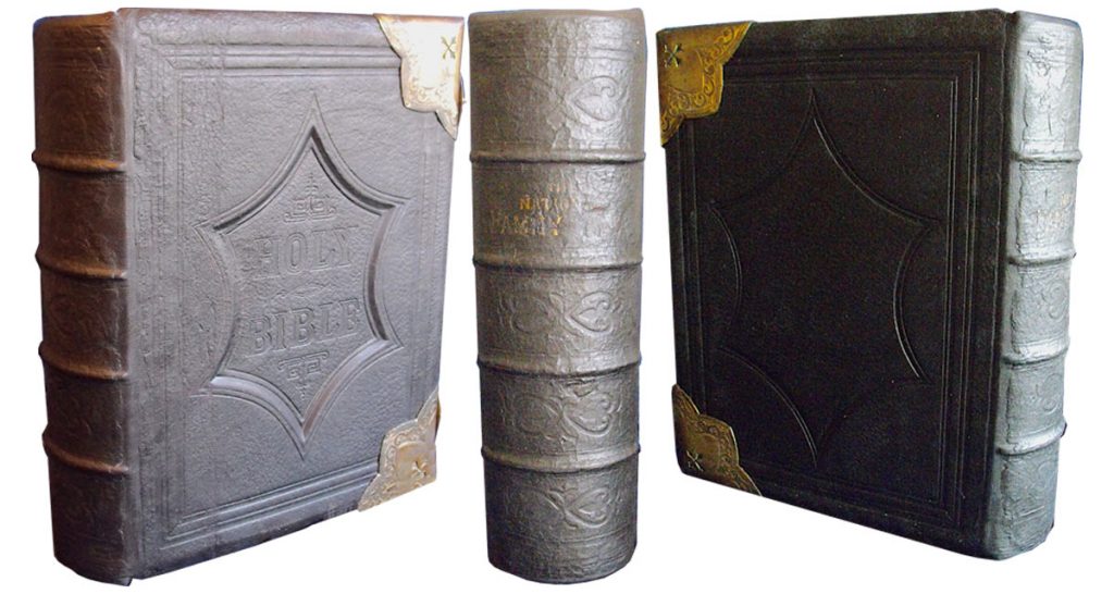 The covers were re-attached and the original spine was mounted onto the replacement leather spine.