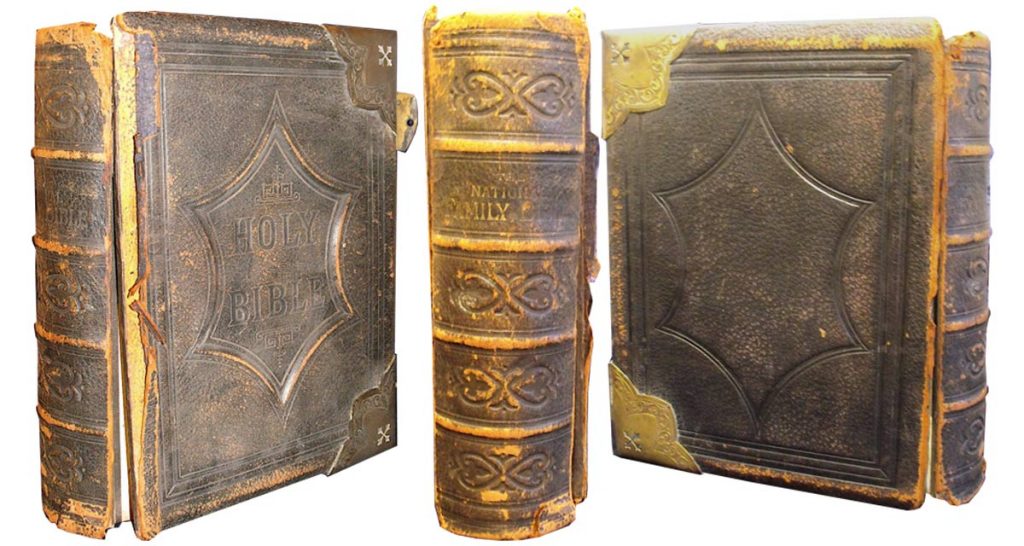 This family Bible had detached covers and a worn spine.